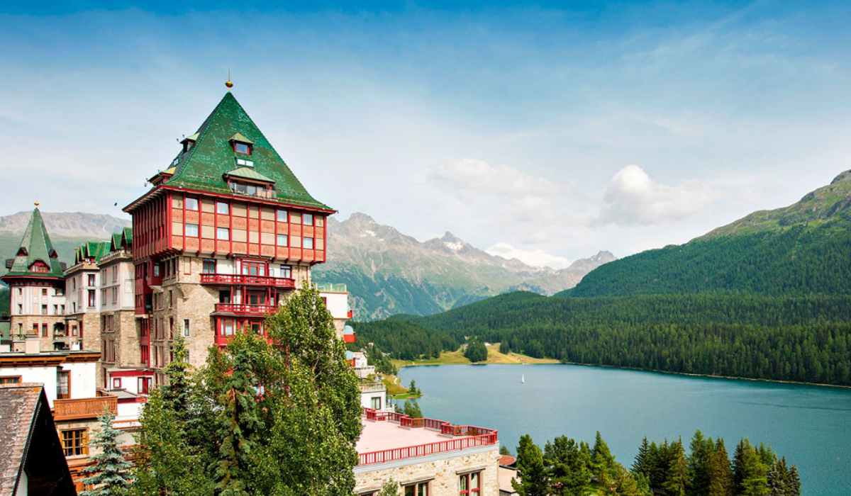 Badrutts Hotel on the side of Lake St Moritz in the summer