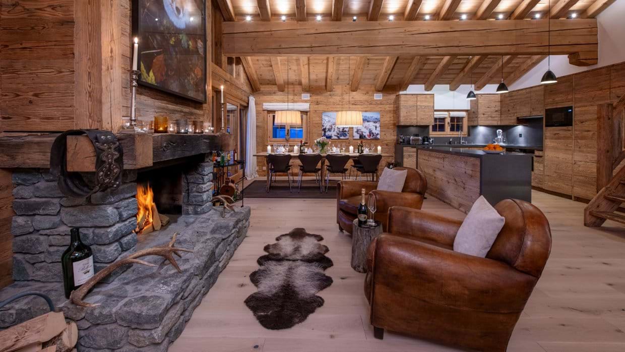 Kitchen and dining room with fireplace in Penthouse Treize Etoiles.jpg